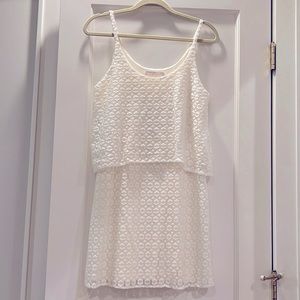 White lace dress with forgiving style. Size M.